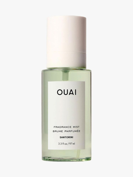 Transparent bottle of OUAI Santorini Hair and Body Mist with white cap on light gray background
